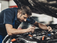 mechanic servicing a car picture